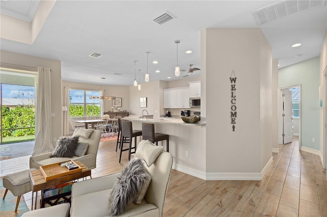 living room with light hardwood / wood-style floors