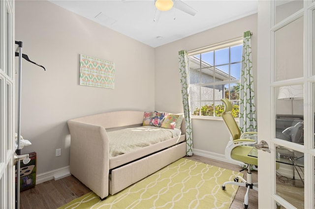 bedroom featuring hardwood / wood-style flooring and ceiling fan