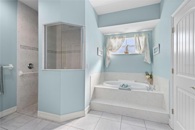 bathroom featuring independent shower and bath and tile patterned flooring