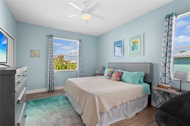 bedroom featuring dark hardwood / wood-style floors and ceiling fan