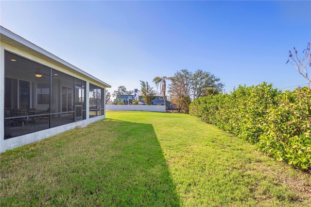 view of yard with a sunroom