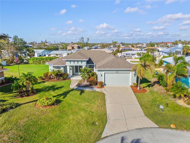 view of front of property featuring a garage and a front lawn