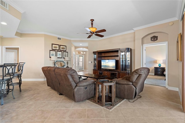 tiled living room with french doors, ceiling fan, and crown molding