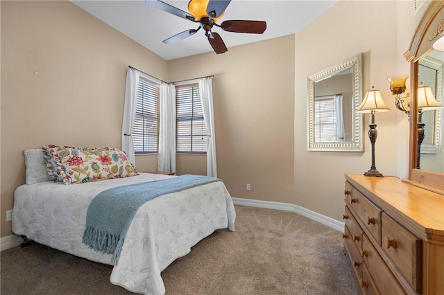 bedroom featuring ceiling fan and carpet