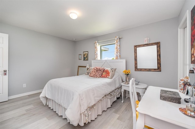 bedroom with light hardwood / wood-style floors