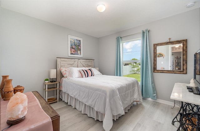 bedroom with light wood-type flooring