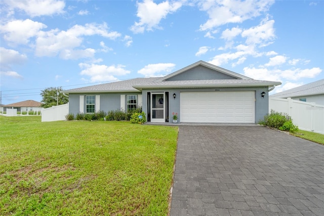 ranch-style home with a garage and a front lawn