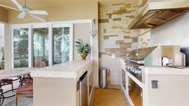 kitchen featuring ceiling fan, light tile patterned floors, refrigerator, and extractor fan