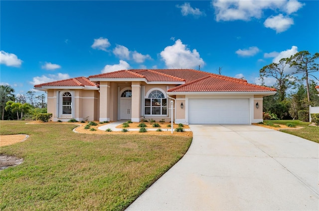 mediterranean / spanish-style home featuring a front yard and a garage