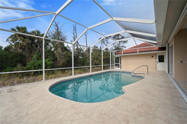 view of pool featuring a lanai and a patio