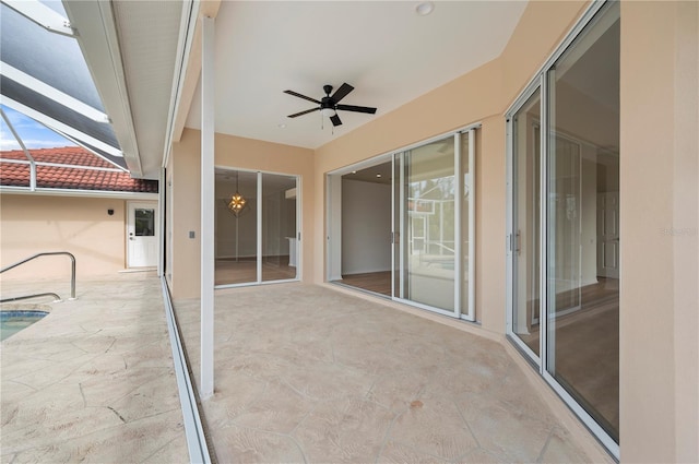 view of patio / terrace with ceiling fan and a lanai