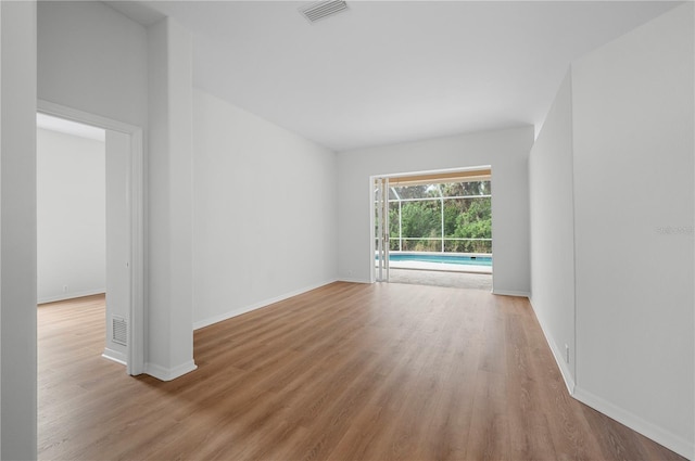 spare room featuring light wood-type flooring