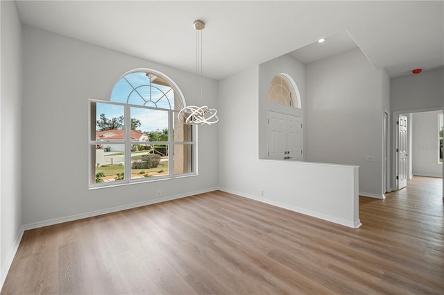 unfurnished dining area featuring hardwood / wood-style flooring