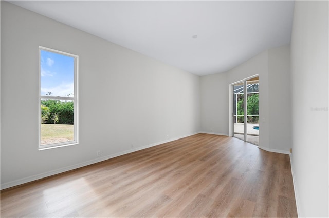 unfurnished room with light wood-type flooring