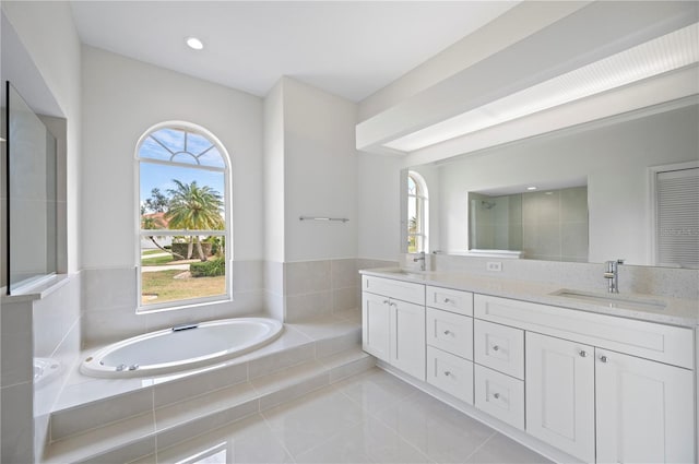 bathroom featuring walk in shower, tile patterned floors, a healthy amount of sunlight, and vanity