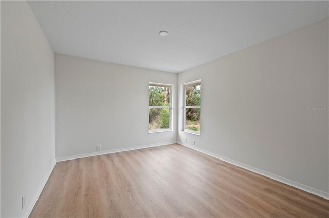 spare room featuring light hardwood / wood-style floors