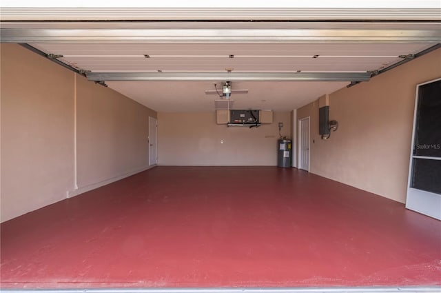 garage with electric water heater and electric panel