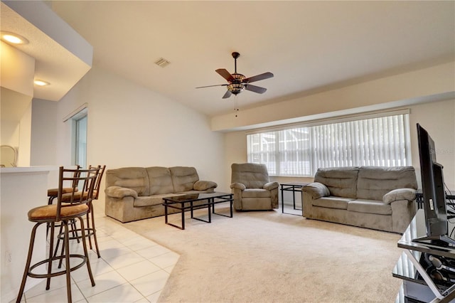 carpeted living room with lofted ceiling and ceiling fan