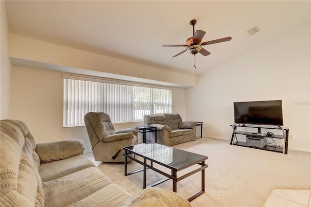 carpeted living room featuring vaulted ceiling and ceiling fan