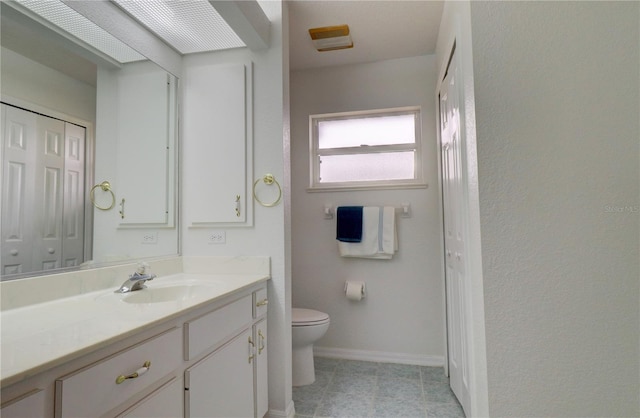 bathroom with toilet and vanity