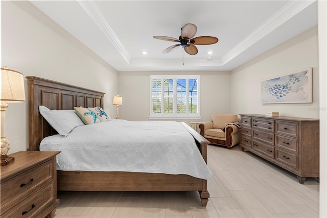 bedroom with ceiling fan, crown molding, and a raised ceiling