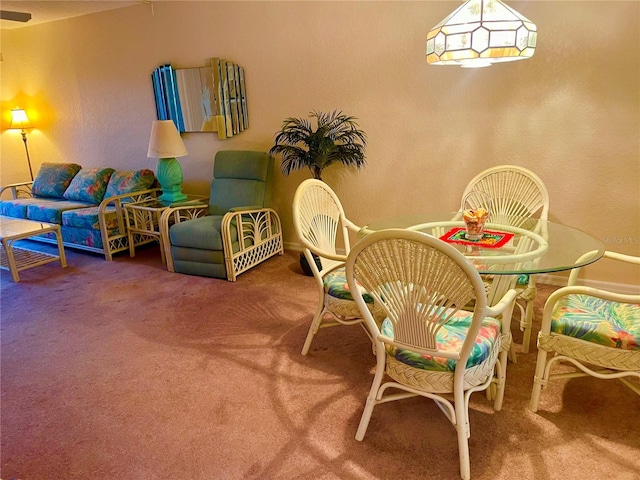 dining space featuring carpet flooring