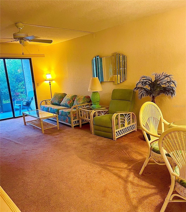 living room featuring carpet and ceiling fan