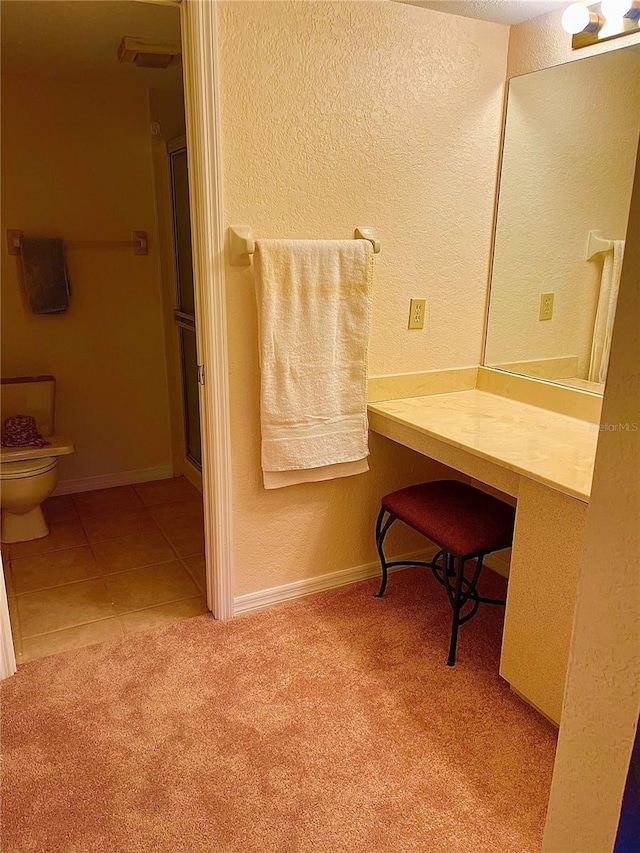 bathroom featuring tile patterned floors and a shower with door