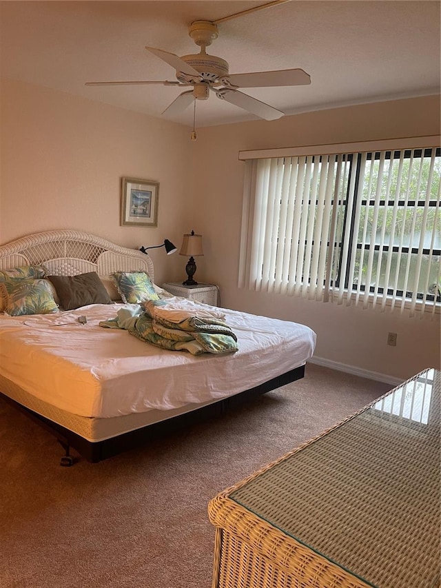 bedroom featuring ceiling fan and carpet flooring