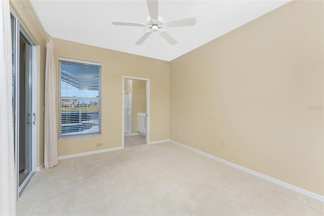 carpeted empty room with ceiling fan