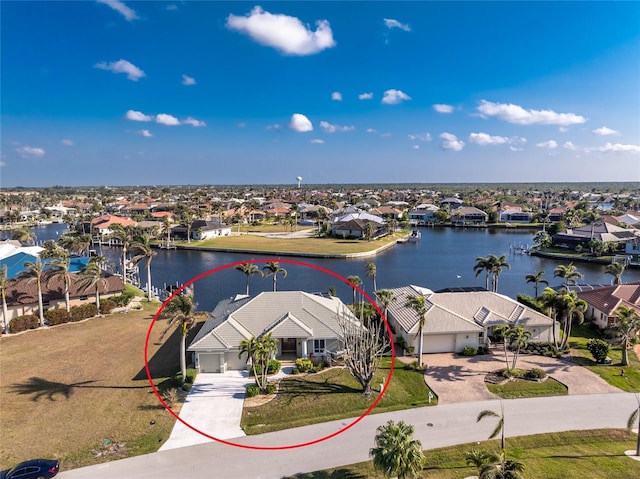 birds eye view of property with a residential view and a water view