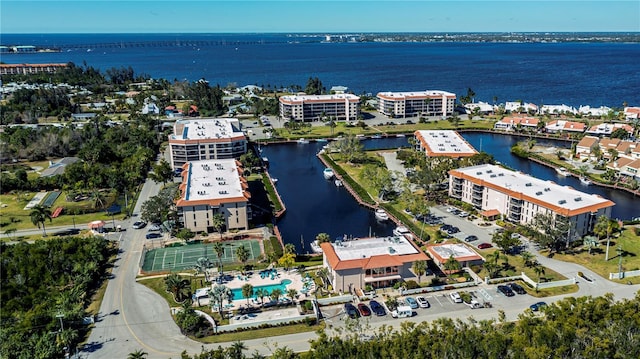 birds eye view of property featuring a water view