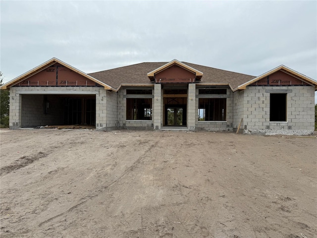 unfinished property with a garage