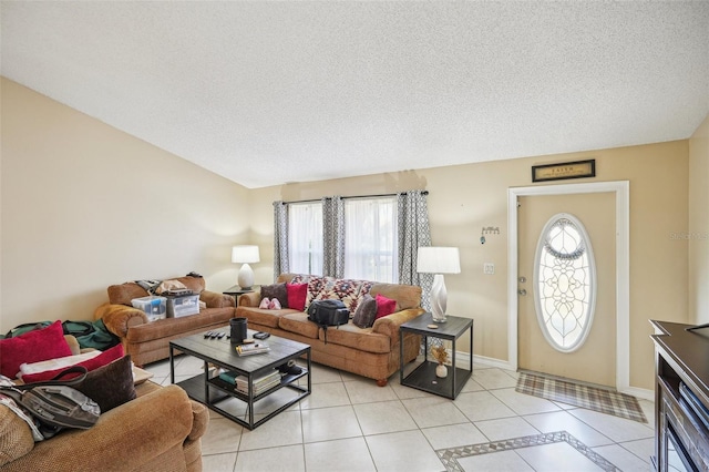 living room featuring a textured ceiling, a healthy amount of sunlight, and light tile patterned floors