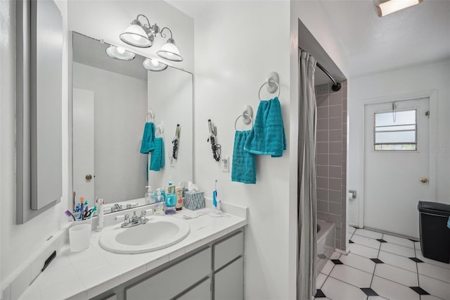 bathroom with shower / tub combo with curtain and vanity