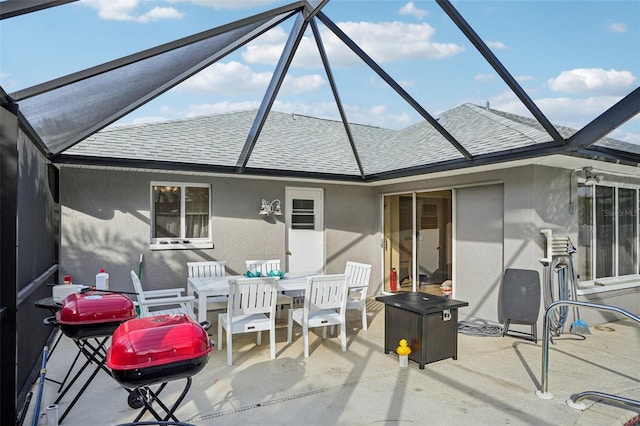 back of house with a patio and glass enclosure