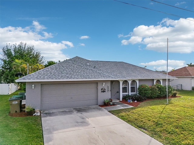 ranch-style house with a garage and a front lawn