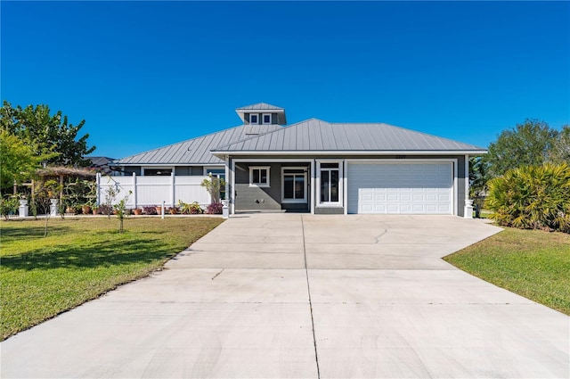 view of front of house with a front lawn and a garage