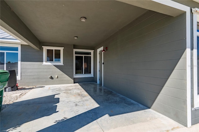 entrance to property with a patio area