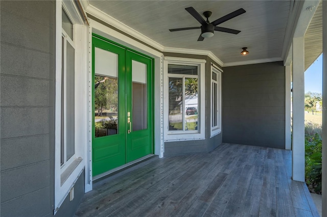 view of exterior entry featuring ceiling fan and french doors