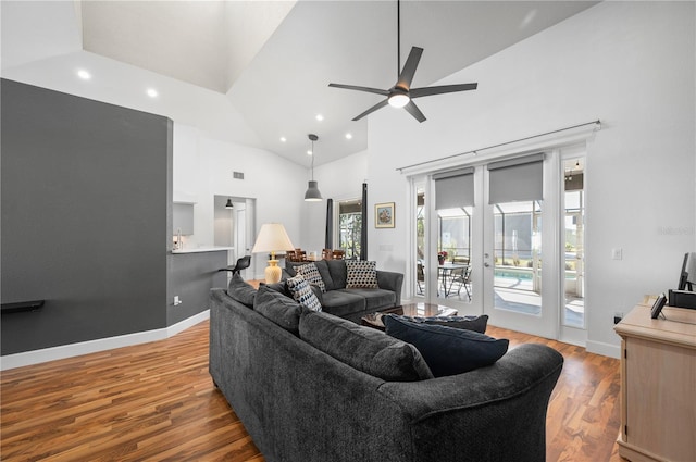 living room featuring high vaulted ceiling, ceiling fan, french doors, and light hardwood / wood-style flooring