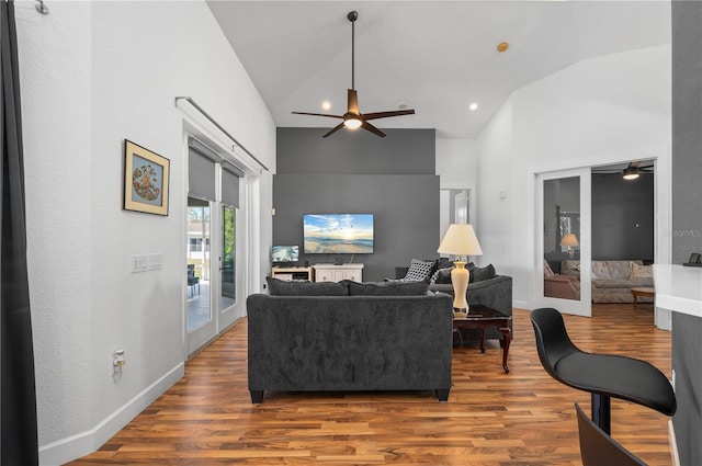 living room with ceiling fan, french doors, and hardwood / wood-style flooring