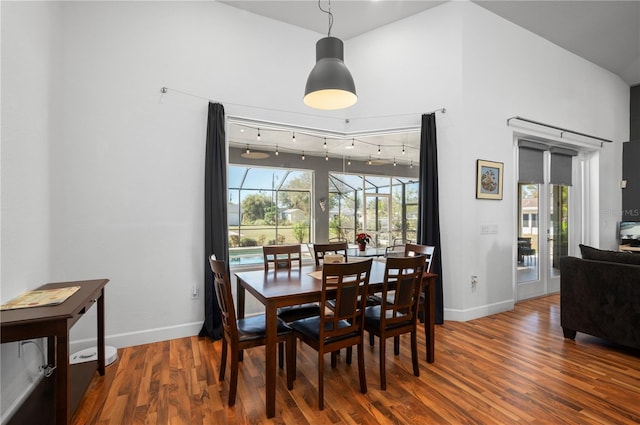 dining room with wood-type flooring