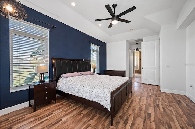 bedroom featuring dark wood-type flooring and ceiling fan