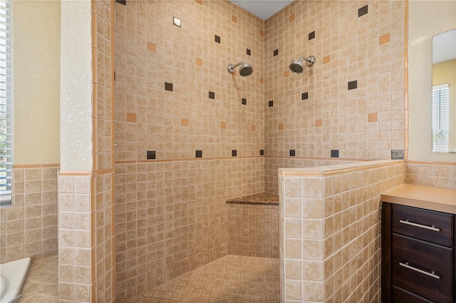 bathroom with tile walls and separate shower and tub