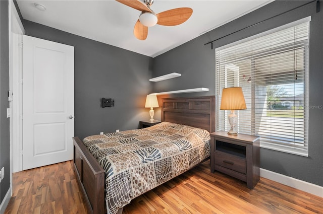 bedroom featuring ceiling fan and wood-type flooring