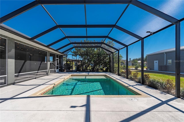 view of pool featuring a patio area and glass enclosure