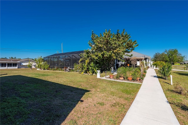 view of yard with glass enclosure