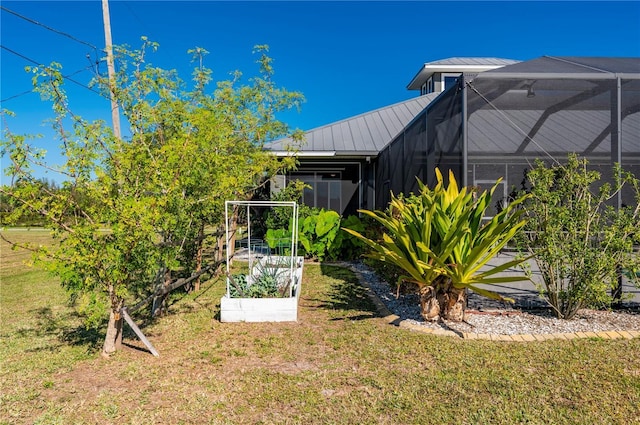 view of yard featuring glass enclosure