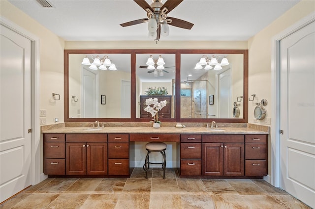 bathroom with an enclosed shower, ceiling fan, and vanity